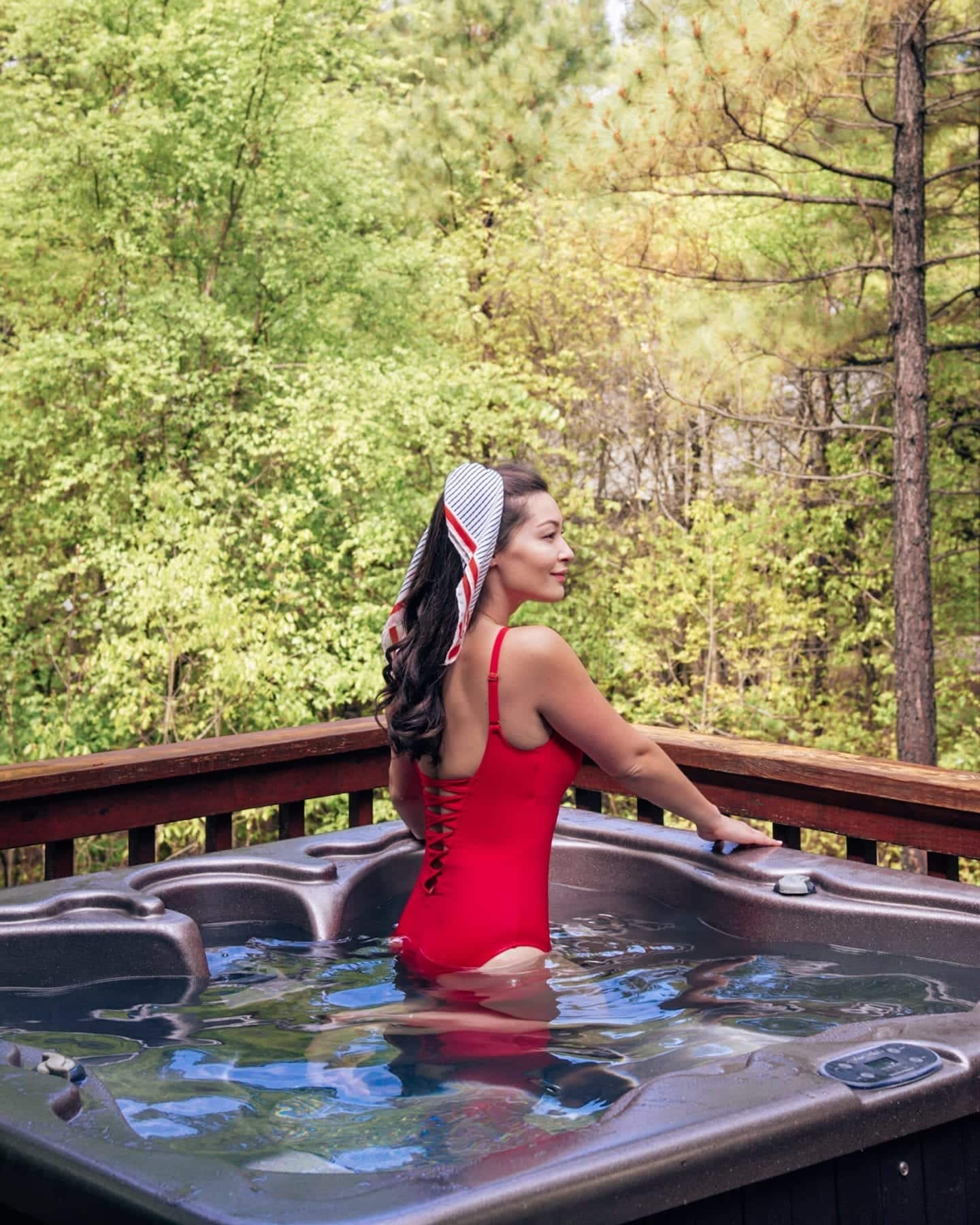 girl in hot tub in forest