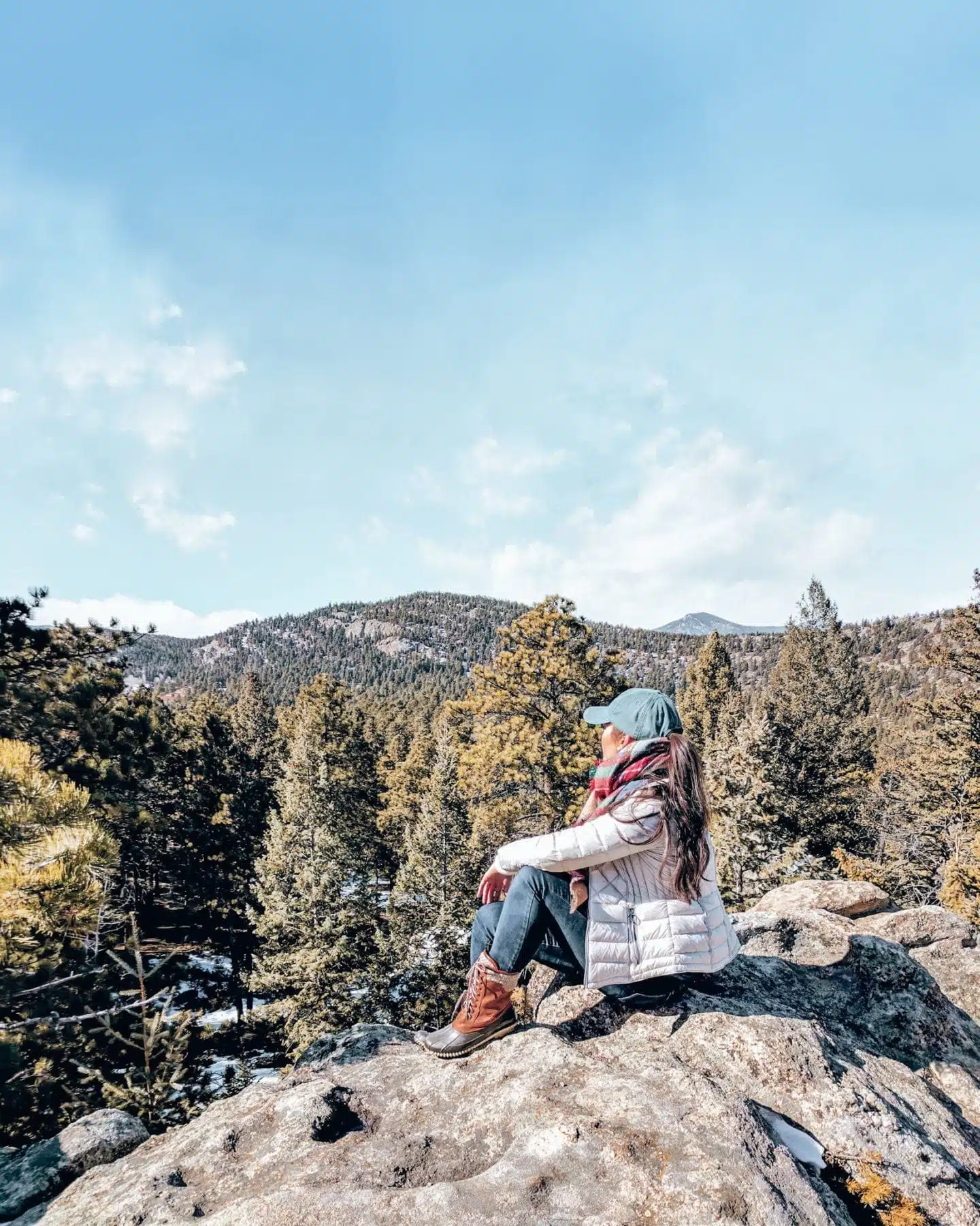 Sitting on a boulder at Alderfer Three Sisters Park, Evergreen - a hidden gem near Denver, Colorado.