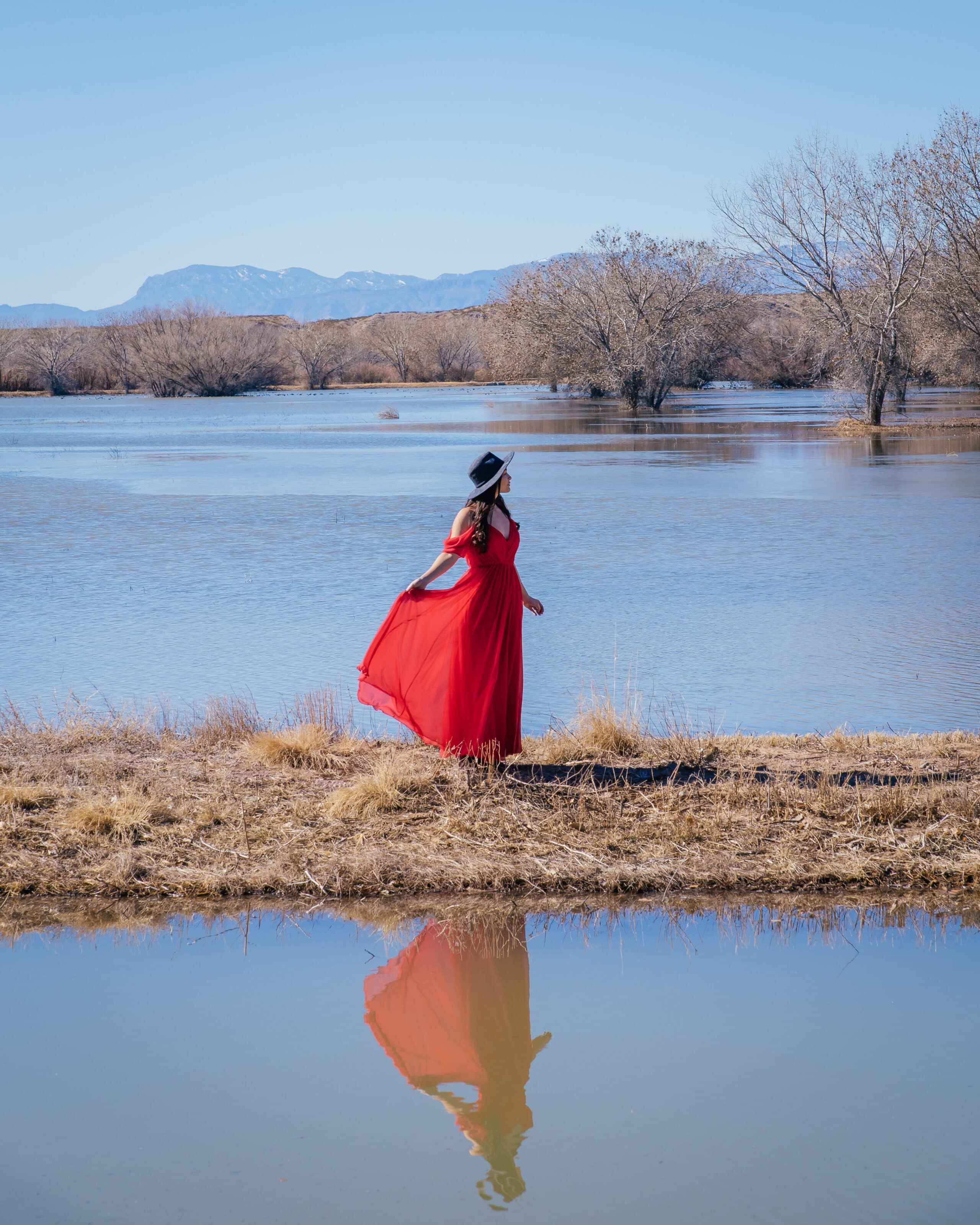 girl in red dress at bosque del apache