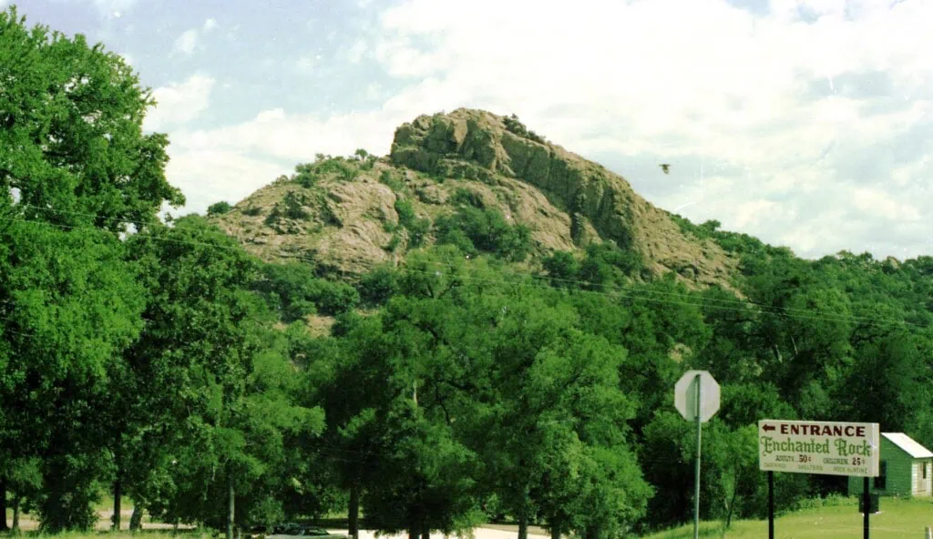 Enchanted Rock pink granite dome with park entrance sign