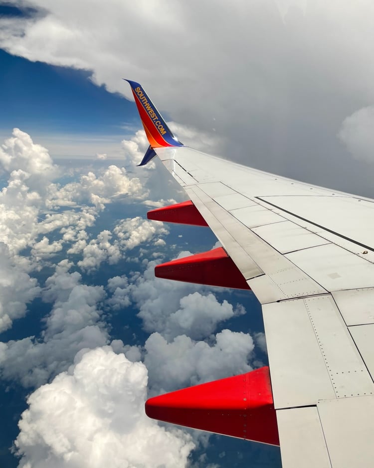 southwest airplane wing in the clouds