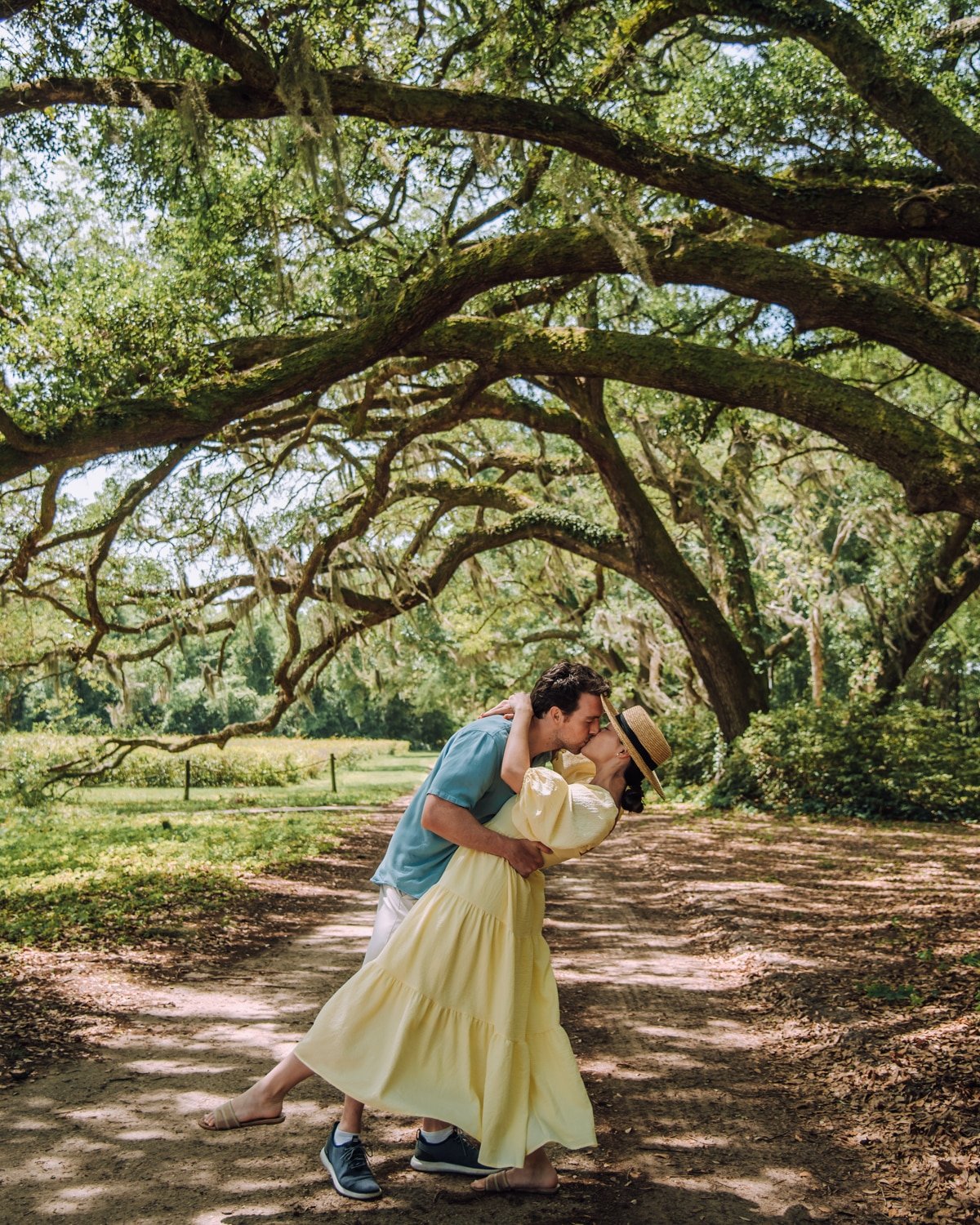 Couple under oak trees at the Charleston Tea Garden