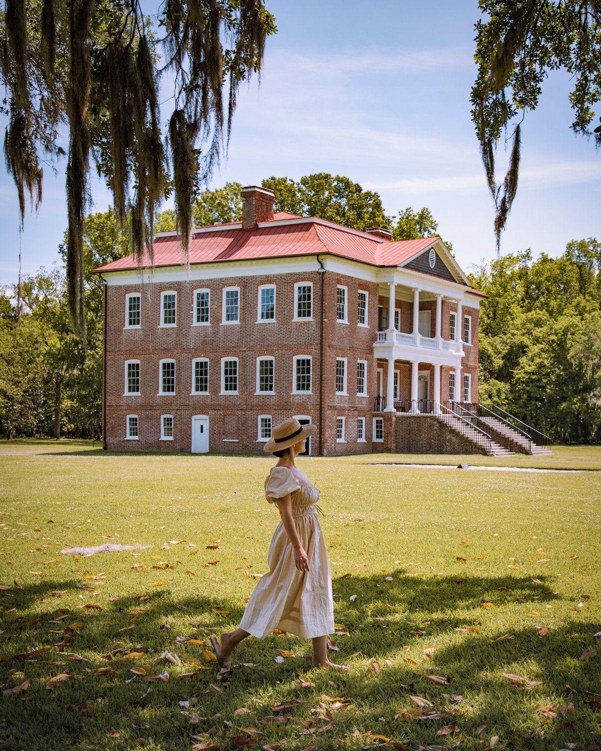 Girl walking in front of Drayton Hall in Charleston