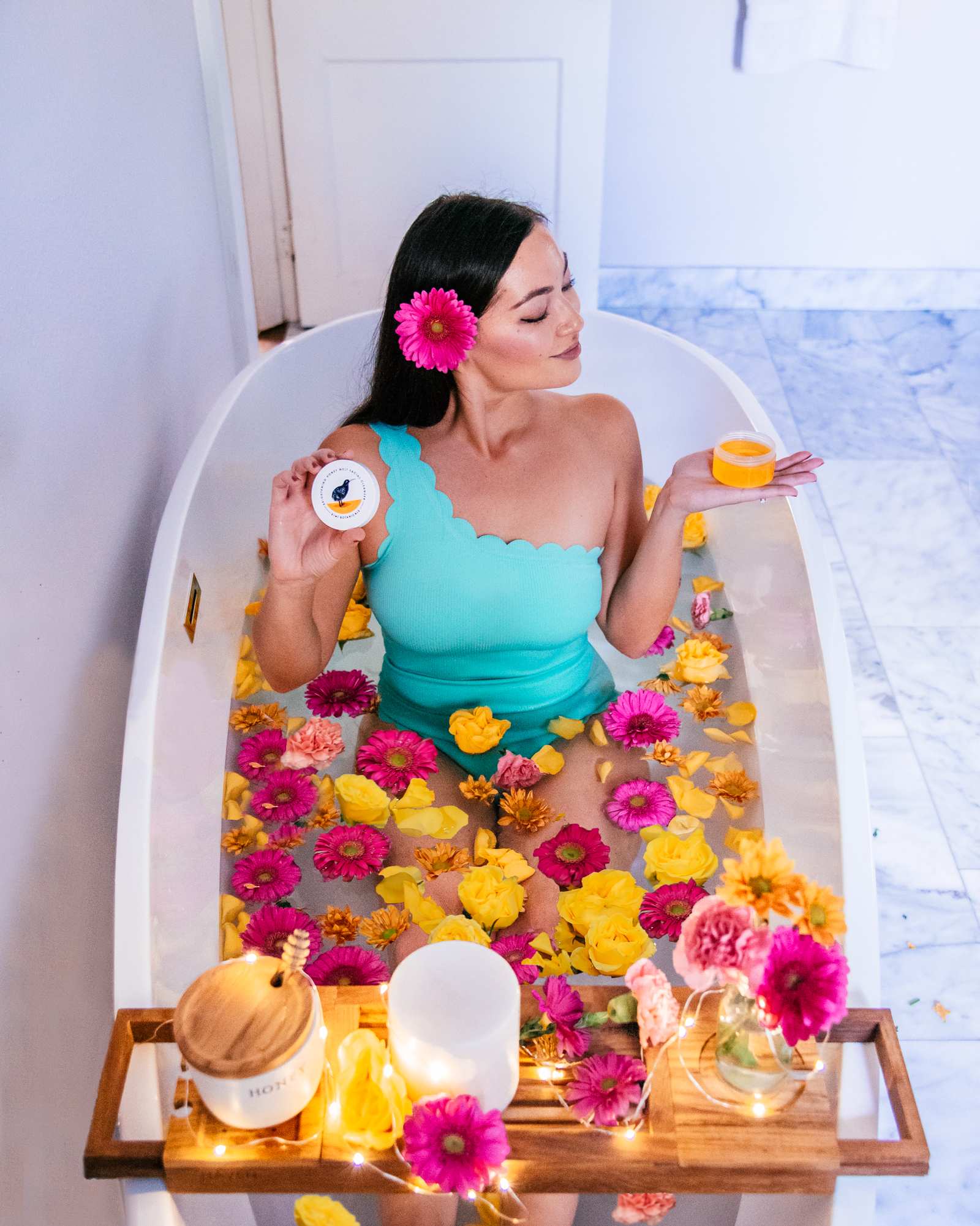 Girl in a flower bath photoshoot.