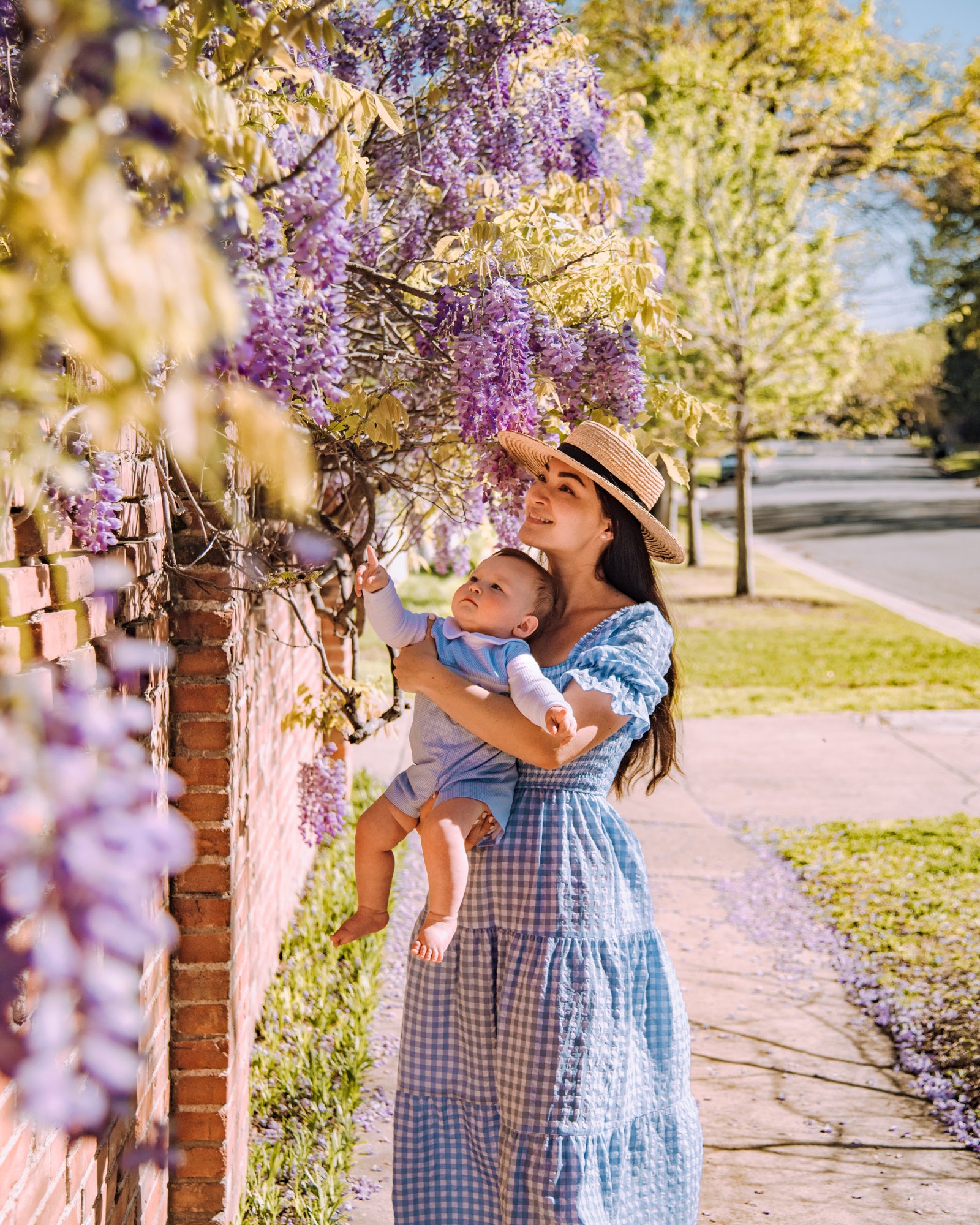 Spring Baby Photoshoot Ideas Intro Image - Mom and Baby Next to Wisteria