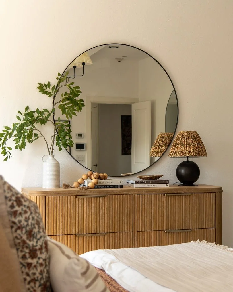 Styled Wooden Dresser With A Mirror In A Bedroom