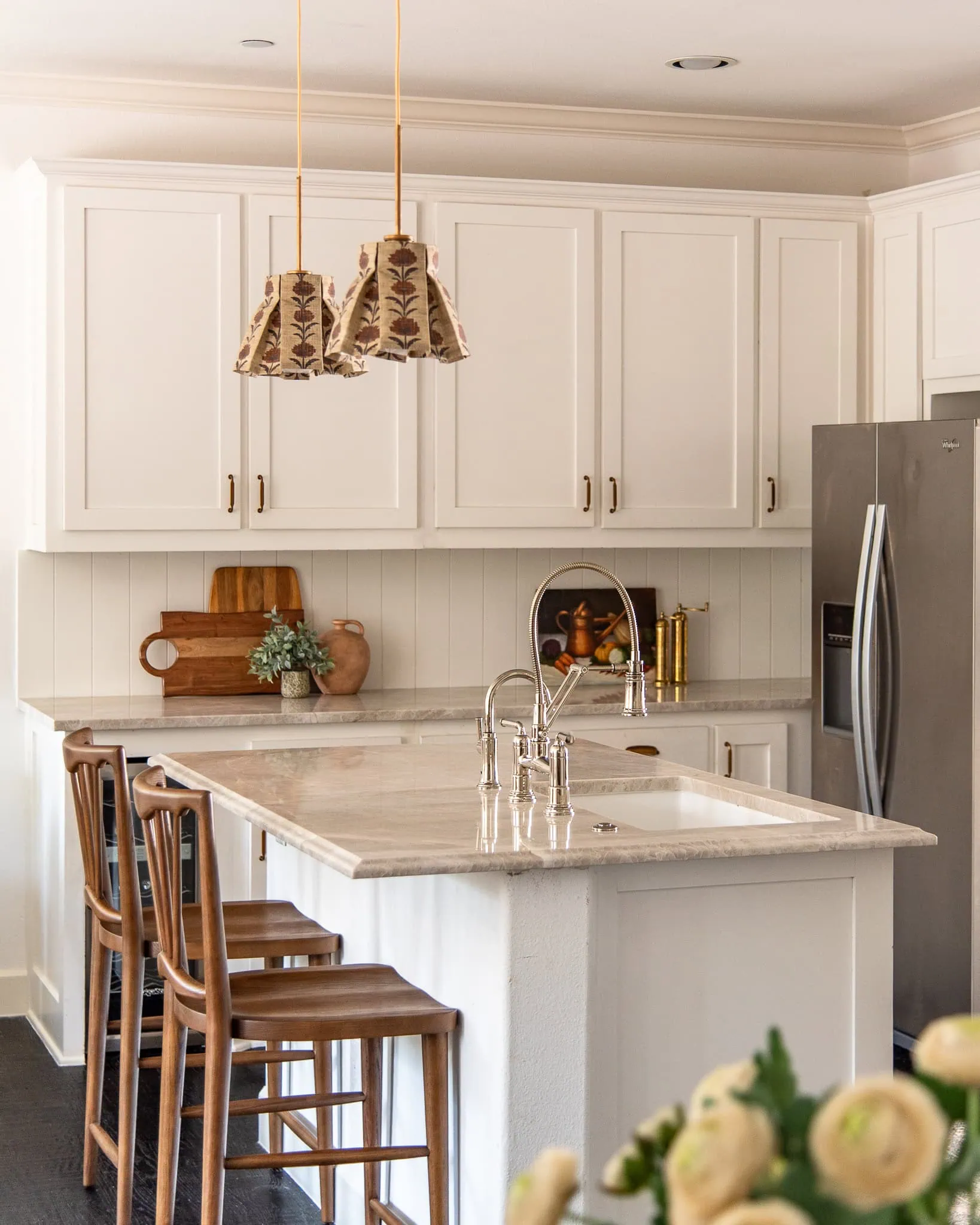 Wood Grounds An Otherwise Light And White Kitchen With Taj Mahal Quartzite Kitchen Countertops and Tongue and Groove Backsplash