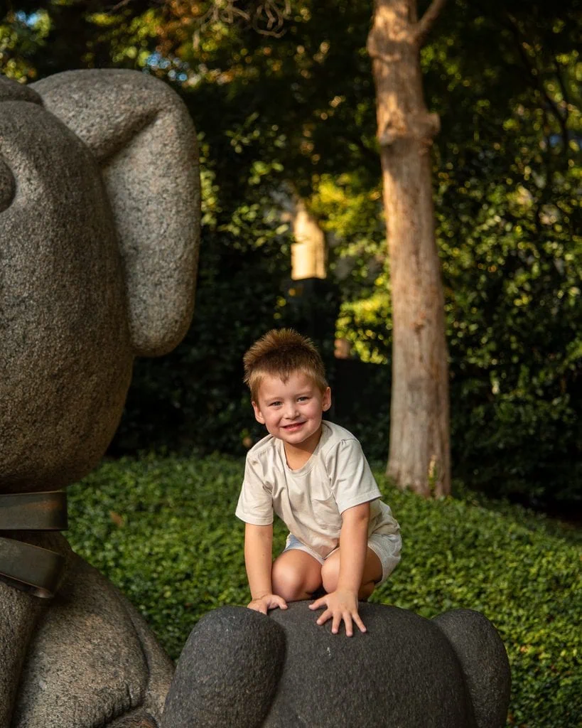 Boy On Bear Statue
