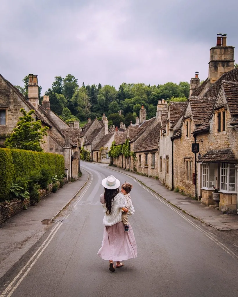 Walking Down The Road In Castle Combe
